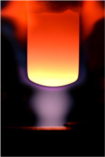 Picture of a glowing graphite sample in a high-enthalpy plasma stream.